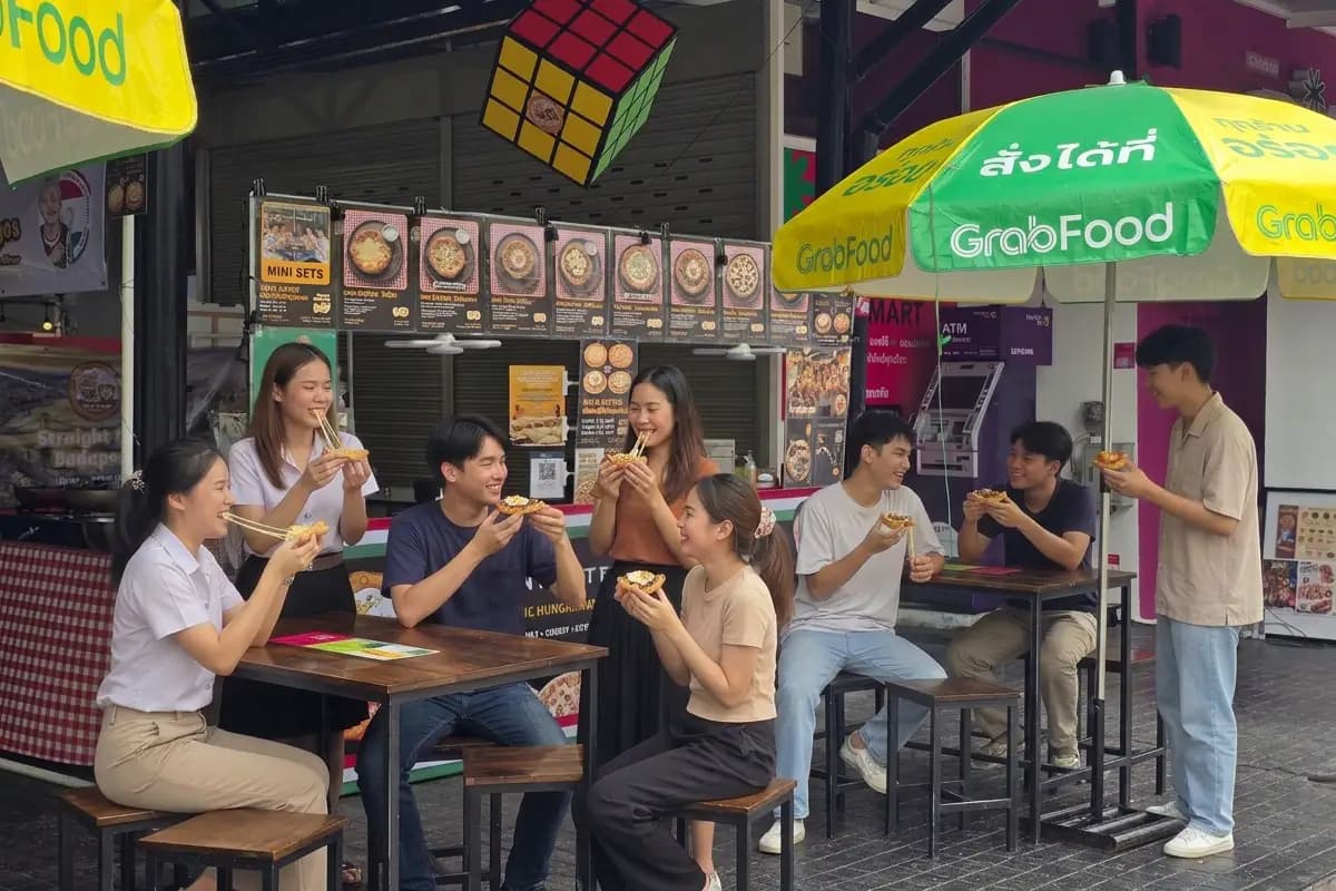 Customers enjoying Hello Europe lángos